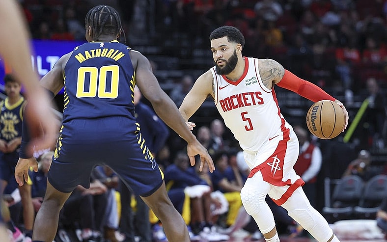 Oct 10, 2023; Houston, Texas, USA; Houston Rockets guard Fred VanVleet (5) dribbles the ball as Indiana Pacers guard Bennedict Mathurin (00) defends during the second quarter at Toyota Center. Mandatory Credit: Troy Taormina-USA TODAY Sports