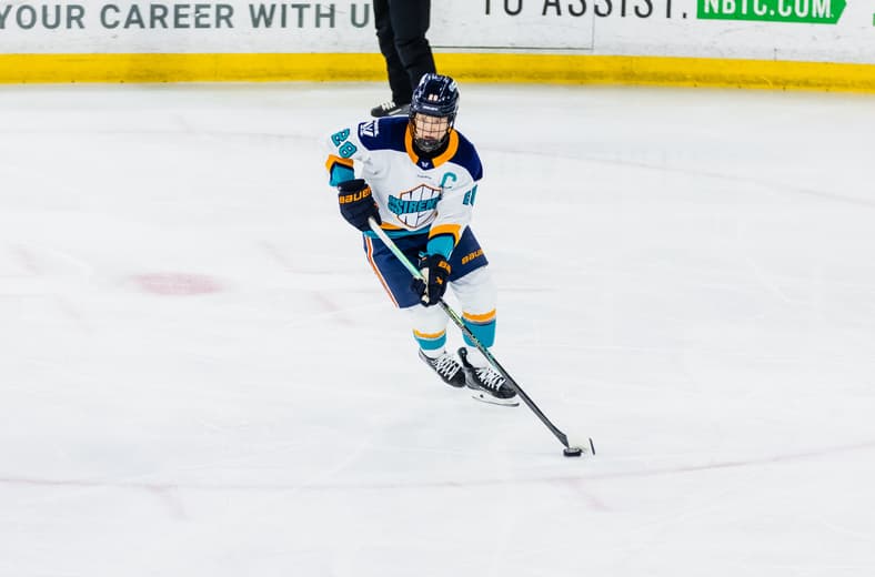 New York Sirens captain Micah Zandee-Hart carries the puck against the Boston Fleet.