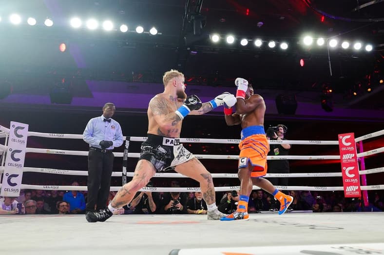 Dec 15, 2023; Orlando, Florida, USA; Jake Paul fights Andre August in the first round at the Caribe Royale Orlando. Mandatory Credit: Nathan Ray Seebeck-USA TODAY Sports