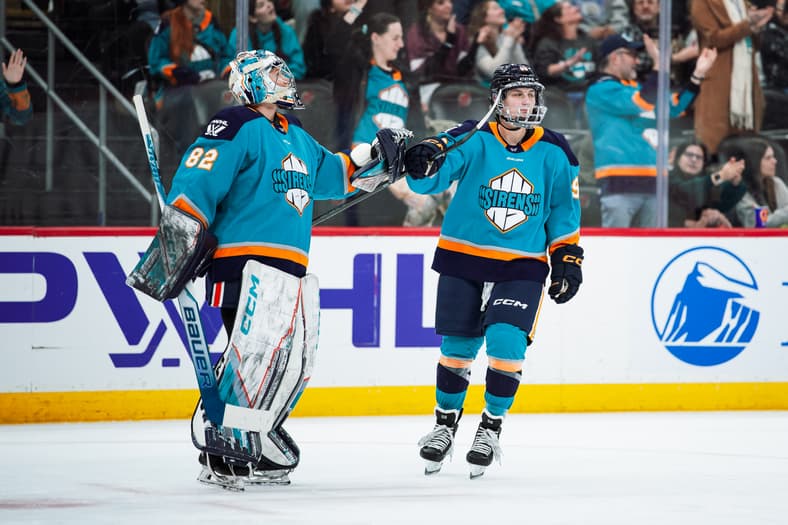 New York Sirens forward Kristyna Kaltounkova fist bumps goalie Kayle Osborne