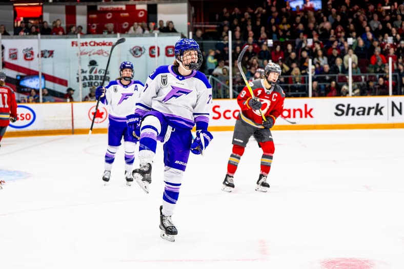 Minnesota Frost forward Britta Curl-Salemme celebrates a goal against the Ottawa Charge.