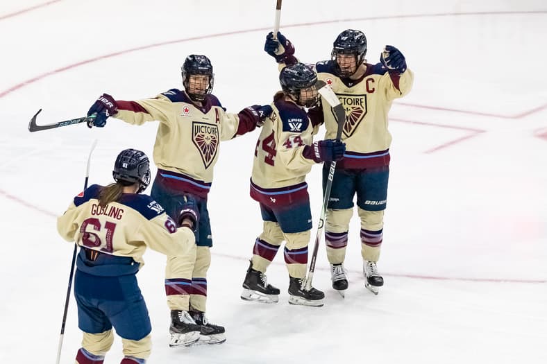 Nicole Gosling, Laura Stacey, Amanda Boulier, and Marie-Philip Poulin celebrate a goal against the Toronto Sceptres as the Montreal Victoire extend their winning streak to six games.