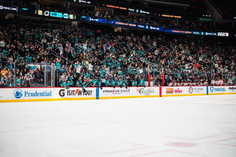 New York Sirens fans cheer at Prudential Center above the Sirens bench.