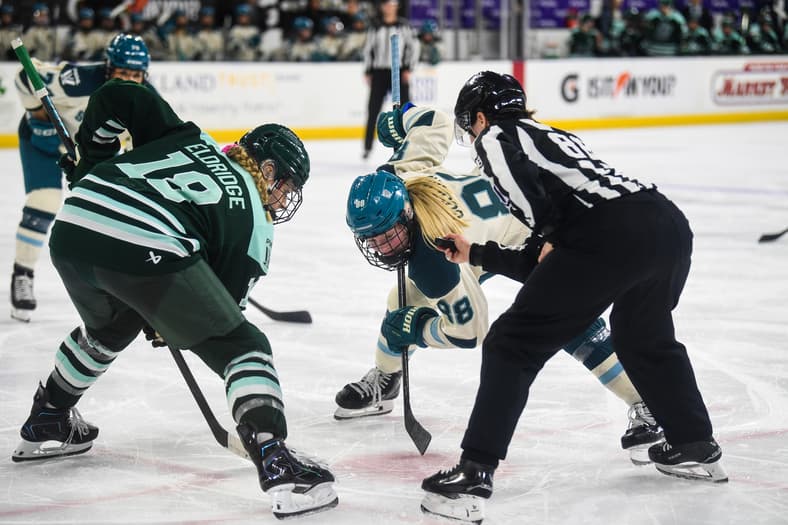 Newly acquired Boston Fleet forward Jessie Eldridge takes a faceoff against Seattle Torrent forward Julia Gosling.