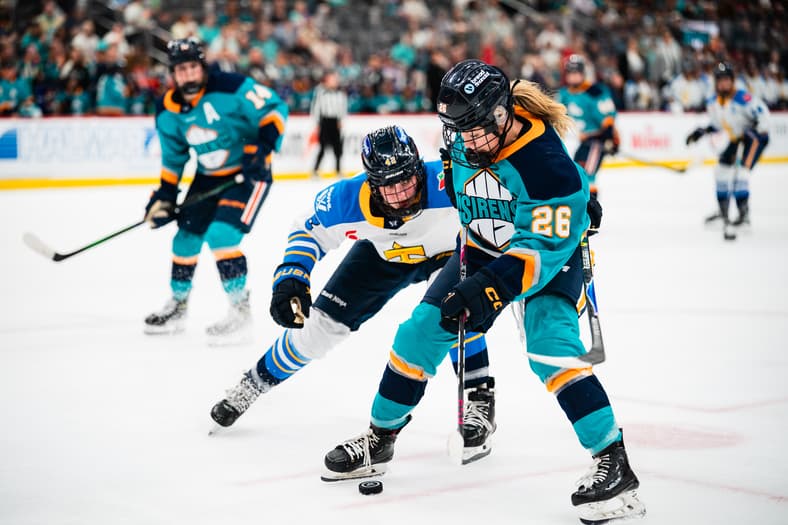 New York Sirens rookie forward Casey O'Brien battles for the puck against the Toronto Sceptres.