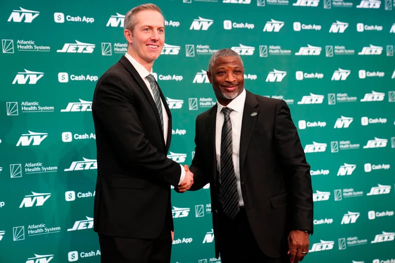New York Jets General Manager Darren Mougey and Jets Head Coach Aaron Glenn, shake hands as they pose for the press, at the