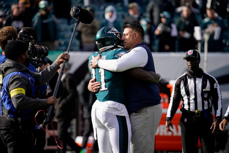 Tennessee Titans head coach Mike Vrabel hugs Philadelphia Eagles wide receiver A.J. Brown (11) as the teams get ready to face