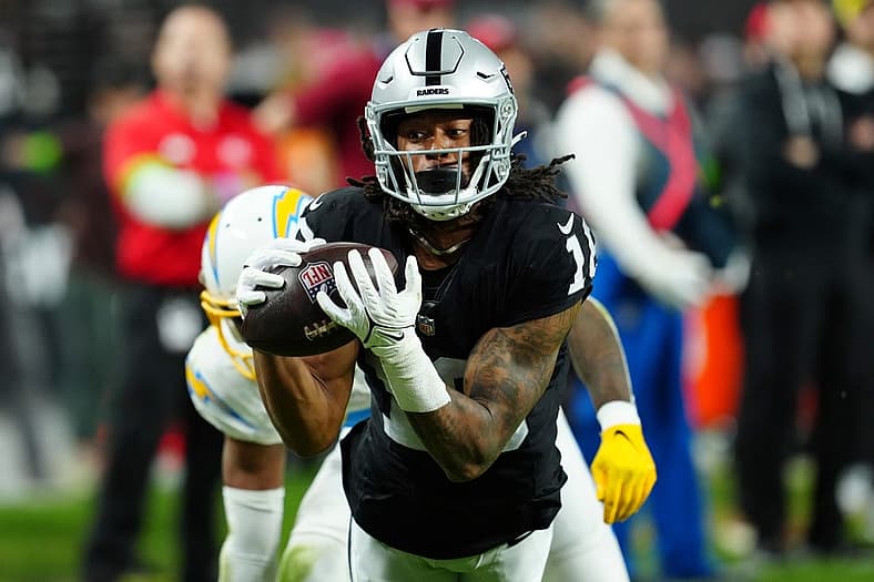 Dec 14, 2023; Paradise, Nevada, USA; Las Vegas Raiders wide receiver Jakobi Meyers (16) makes a catch for a touchdown against the Los Angeles Chargers in the first quarter at Allegiant Stadium. Mandatory Credit: Stephen R. Sylvanie-USA TODAY Sports