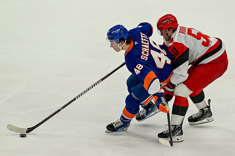 Apr 14, 2026; Elmont, New York, USA; Carolina Hurricanes left wing Eric Robinson (50) defends against New York Islanders de…