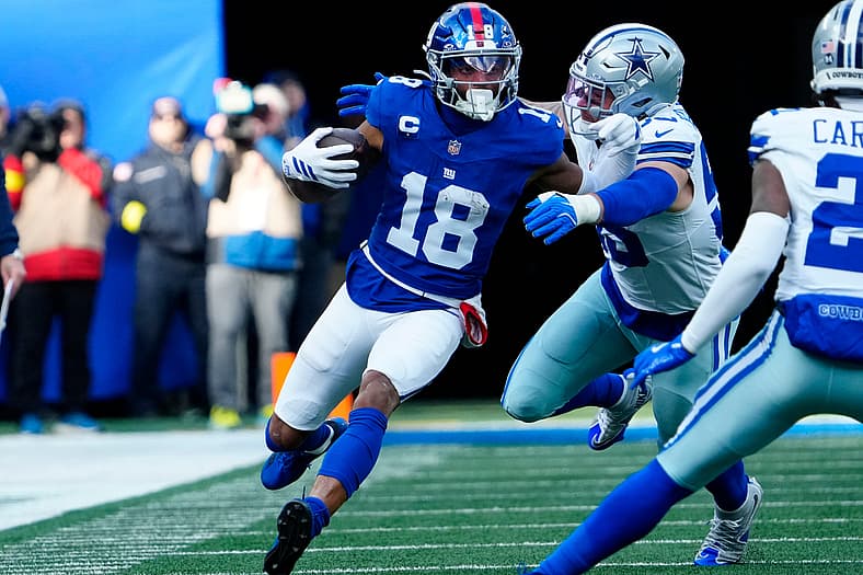 New York Giants wide receiver Darius Slayton (18) runs with the ball, Sunday, January 4, 2026, in East Rutherford.