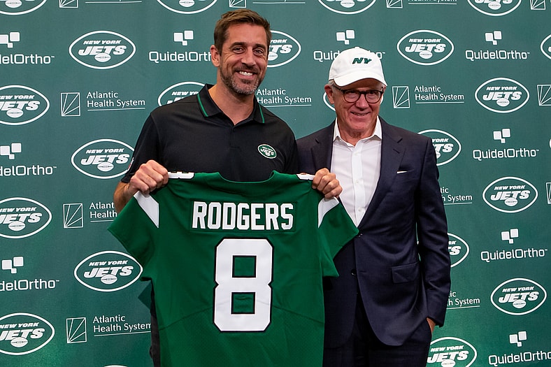 Aaron Rodgers and Woody Johnson