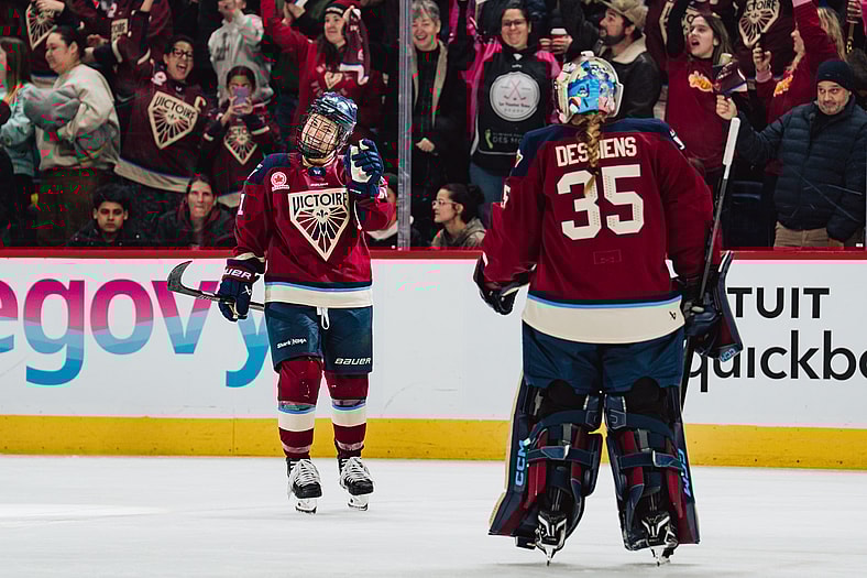Montreal Victoire forward Abby Roque celebrates with goalie Ann-Renee Desbiens.