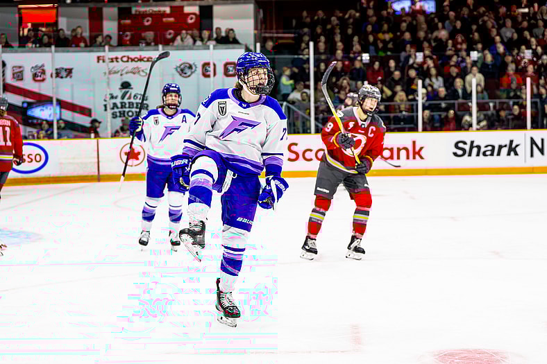 Minnesota Frost forward Britta Curl-Salemme celebrates a goal against the Ottawa Charge.