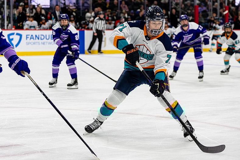 New York Sirens defender Jincy Roese digs the puck out against the Minnesota Frost.