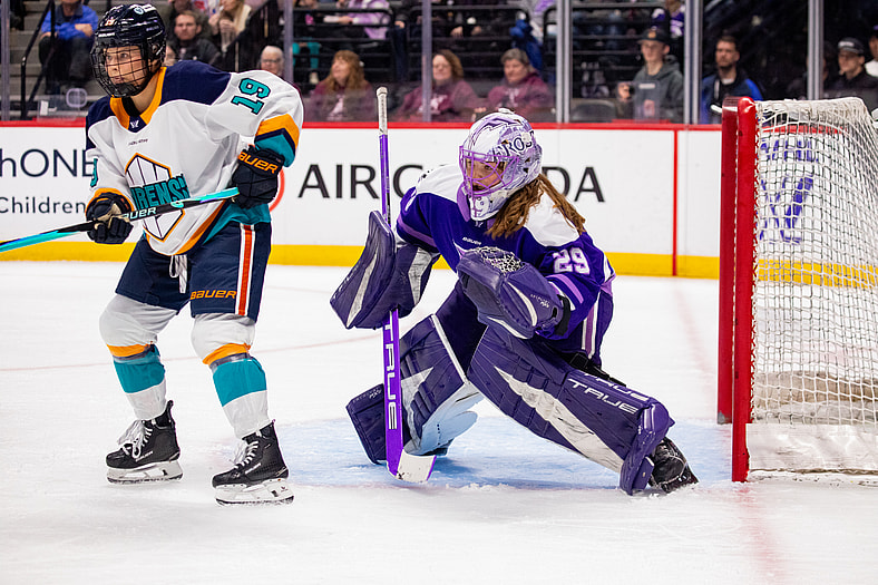 New York Sirens forward Paetyn Levis screens Minnesota Frost goalie Nicole Hensley during the third period in Denver.