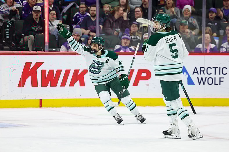 Boston Fleet forward Jamie Lee Rattray celebrates with captain Megan Keller.