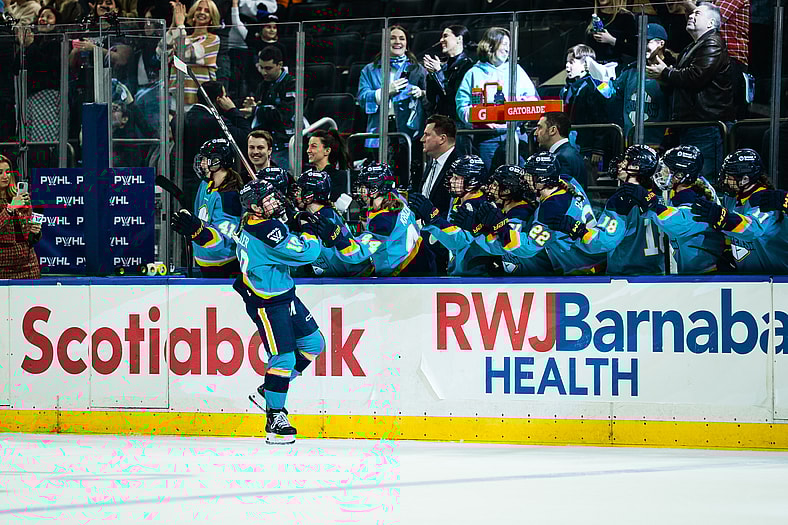 New York Sirens forward Sarah Fillier high-fives teammates after netting the game-tying goal against the Seattle Torrent with 3:35 left in the third period at Madison Square Garden.
