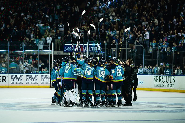 The New York Sirens huddle at center ice to salute 18,006 fans at Madison Square Garden.