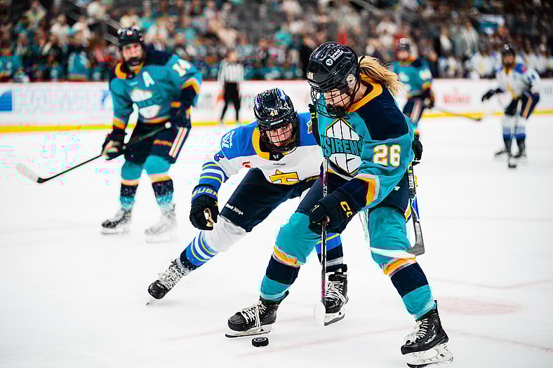 New York Sirens rookie forward Casey O'Brien battles for the puck against the Toronto Sceptres.