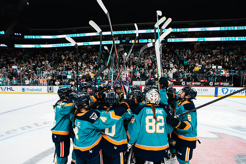 The New York Sirens raise their sticks in salute to fans at Prudential Center after a 3-2 comeback win against the Toronto Sceptres.
