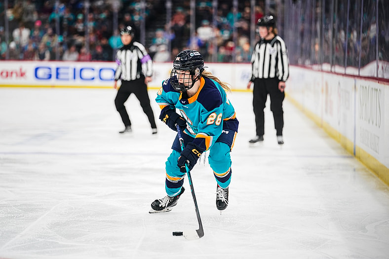 New York Sirens rookie Casey O'Brien carries the puck against the Montreal Victoire.