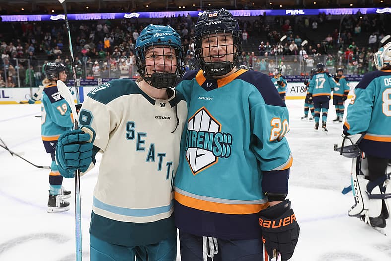 New York Sirens defender Allyson Simpson and Seattle Torrent forward Hannah Bilka at the PWHL's Takeover Tour matchup in Dallas, TX.