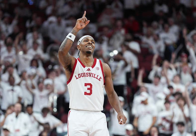 Louisville Cardinals guard Ryan Conwell (3) celebrates after hitting a three-point goal against NC State at the KFC Yum! Center