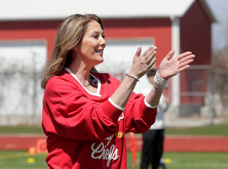 Randi Martin, mother of Kansas City Chiefs quarterback Patrick Mahomes, cheers on kids participating in the quarterback