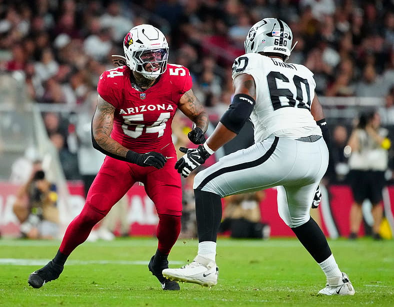 Cardinals edge rusher Xavier Thomas (54) rushes Raiders tackle Charles Grant (60) during a preseason game at State Farm Stadium