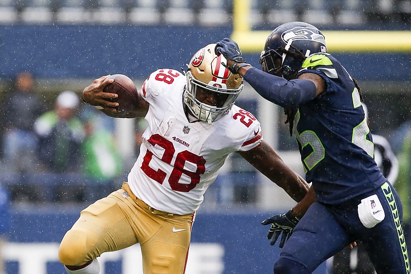 San Francisco 49ers running back Carlos Hyde gets around Seattle Seahawks cornerback Richard Sherman