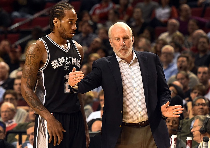 Gregg Popovich talks to Kawhi Leonard