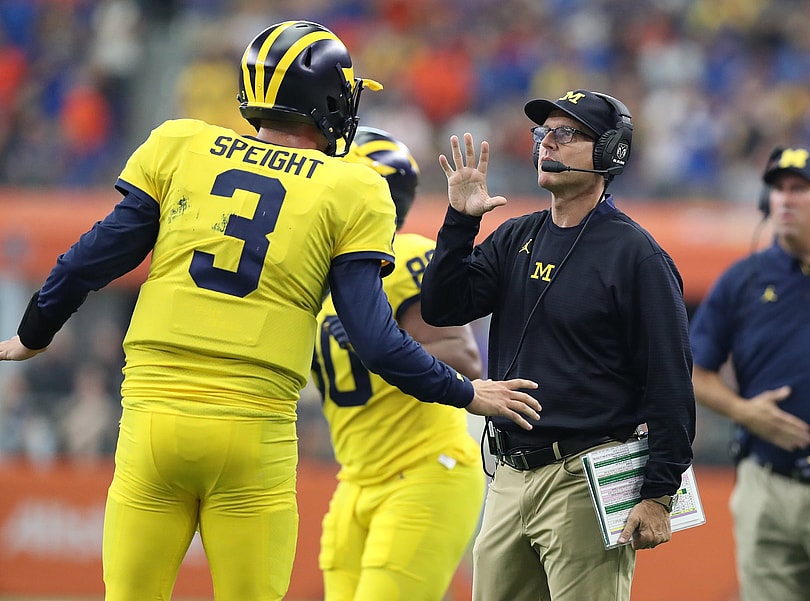 Michigan Quarterback Wilton Speight and head coach Jim Harbaugh